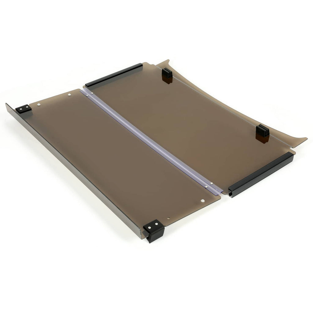 Brown tinted folding windshield with black frame and mounting feet, shown laid flat