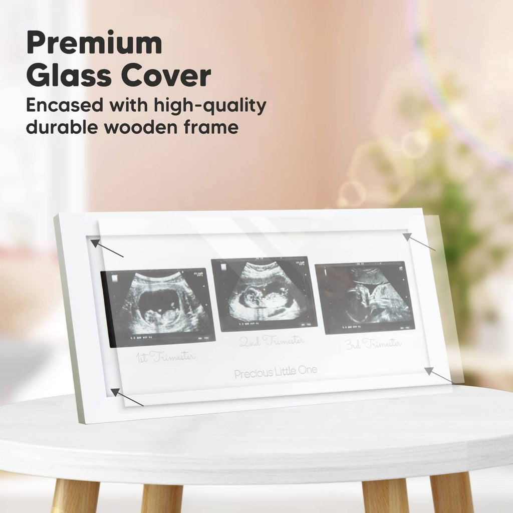 White wooden ultrasound picture frame with clear glass cover and three sonogram panels