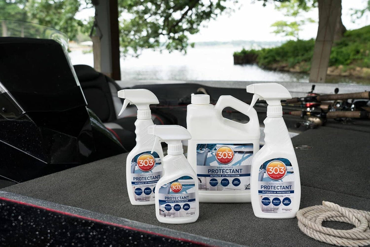 Multiple UV protectant spray bottles grouped together on a boat surface