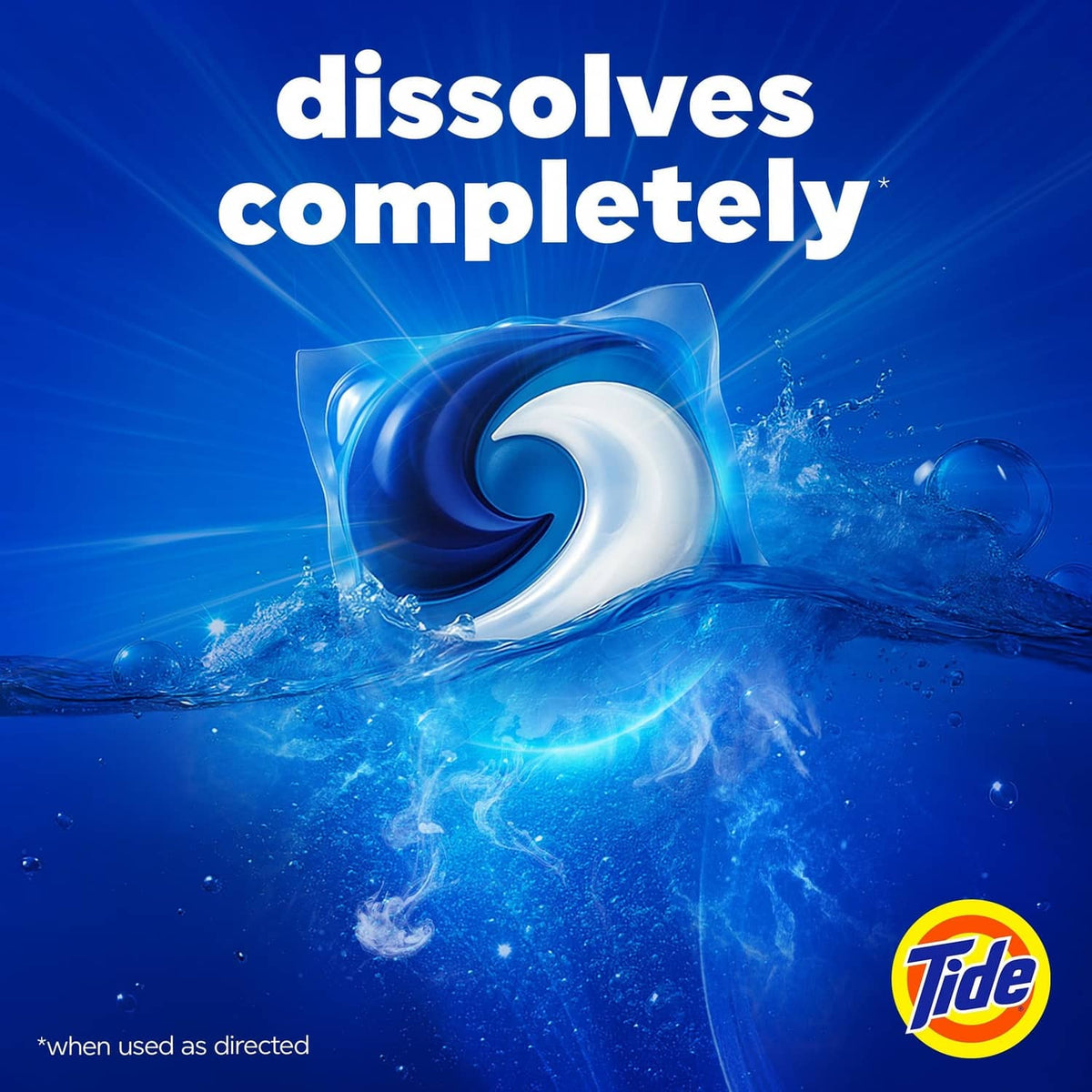 Tide detergent POD dissolving completely in blue water, Tide logo visible