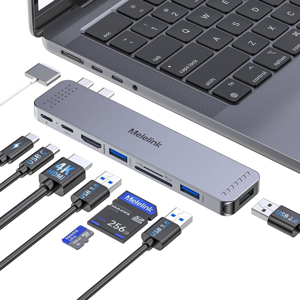 Gray USB-C hub adapter with several ports connected to a laptop