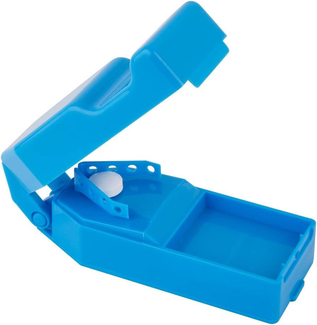Blue pill cutter and splitter with dispenser, angled view of open storage area
