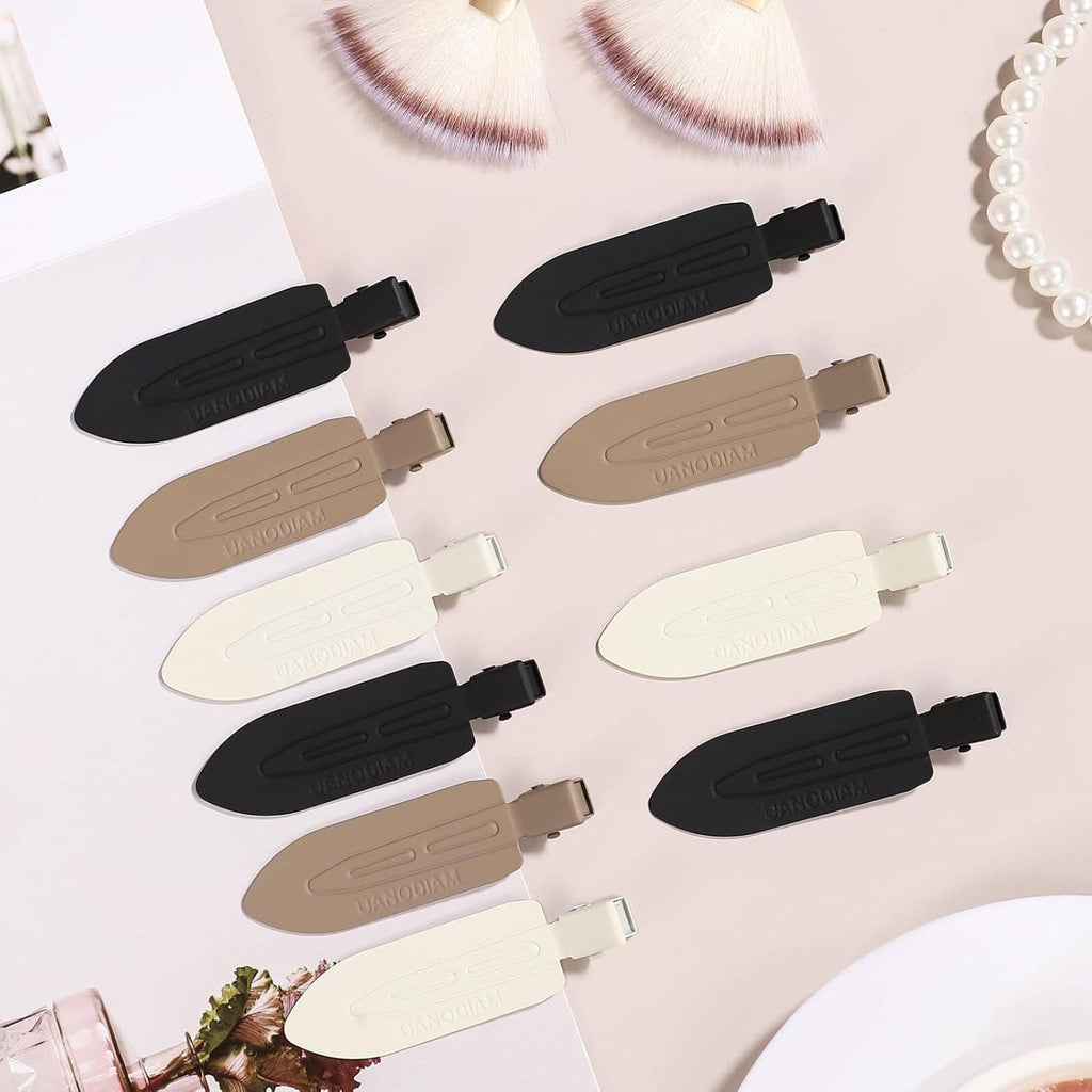 Assorted no-bend hair clips in black, beige, and white with metal hinges