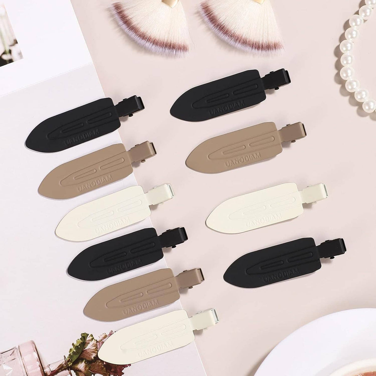 Assorted no-bend hair clips in black, beige, and white with metal hinges