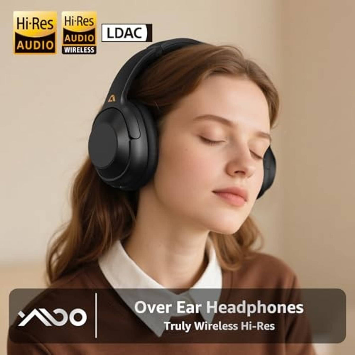 Black over-ear headphones worn over ears with cushioned ear cups