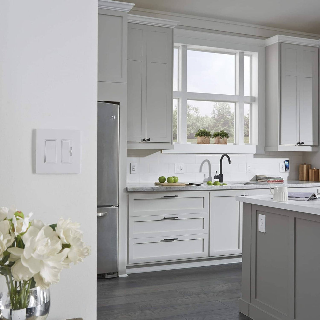 Gray wall-mounted light switch on the kitchen backsplash in a modern home