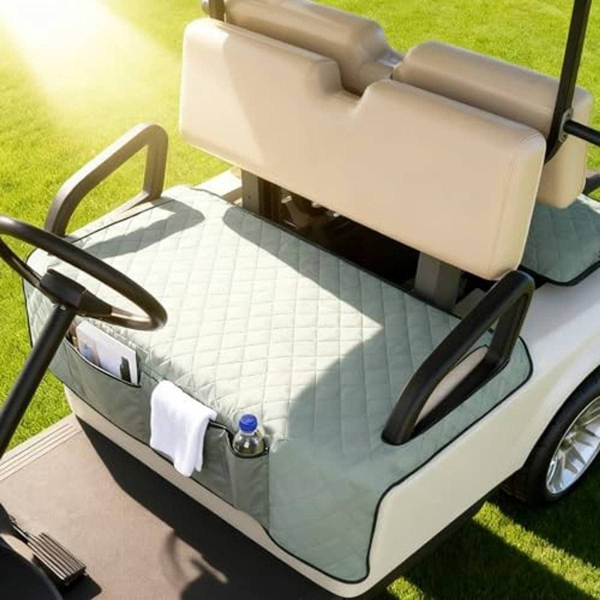 Grey seat cover blanket on golf cart bench with quilted fabric and front towel