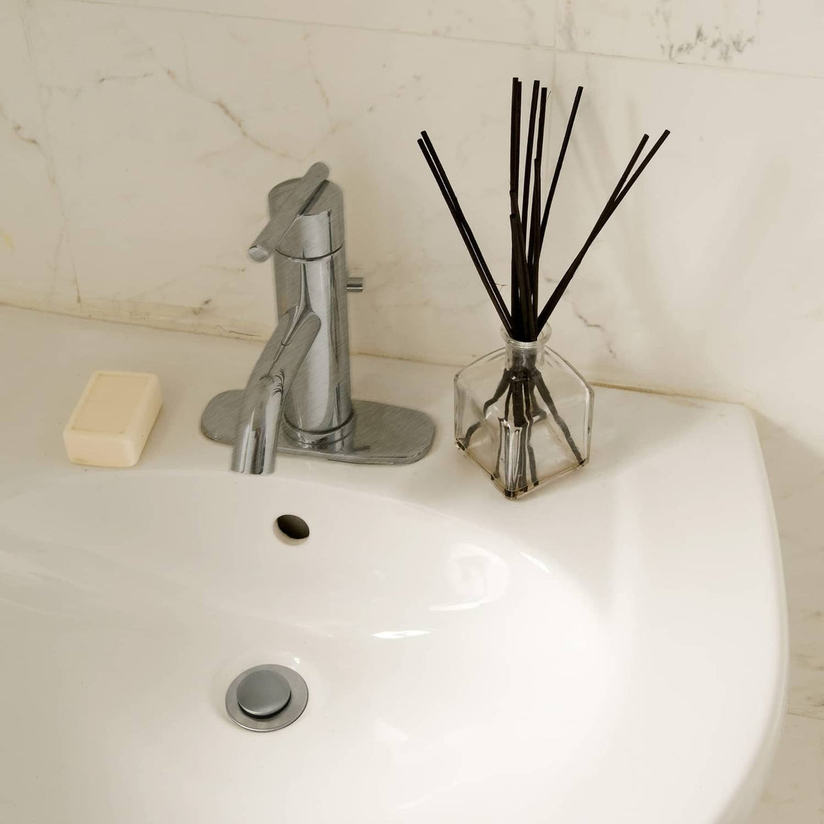 Brushed nickel pop-up sink stopper and drain plug for bathroom sink