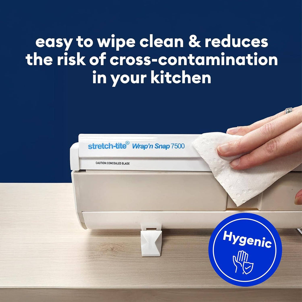 White plastic wrap dispenser with concealed blade, being wiped clean by hand