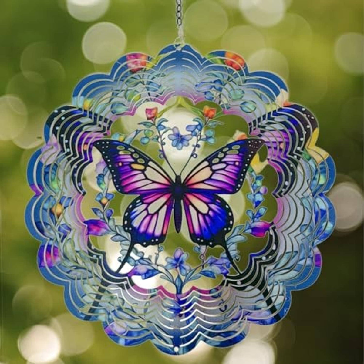 Butterfly wind spinner with purple wings and blue/teal concentric metal circle layers