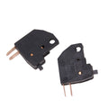 Brake light stop switch with black housing and two spade terminals, metal contacts visible