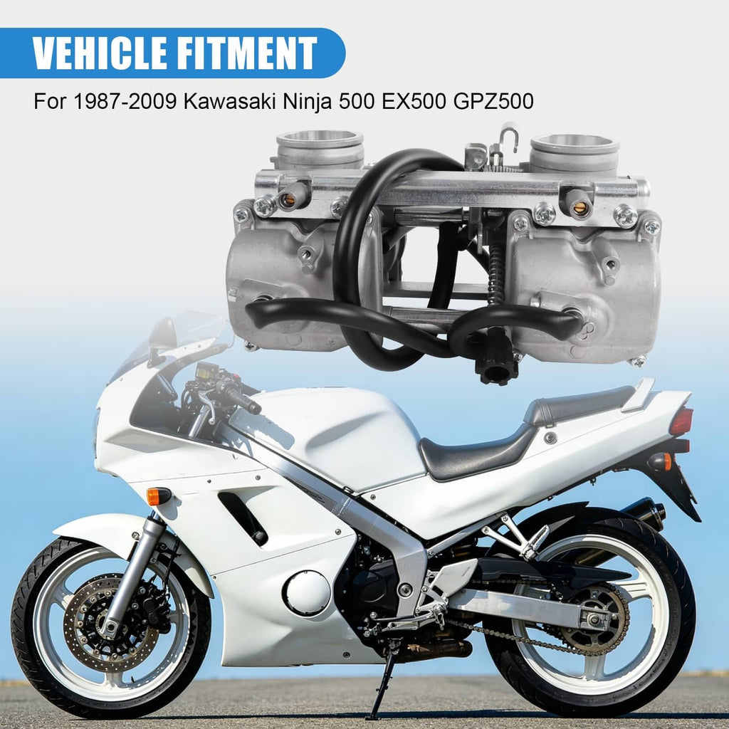 Carburetor assembly mounted on motorcycle intake area with black hoses and silver body