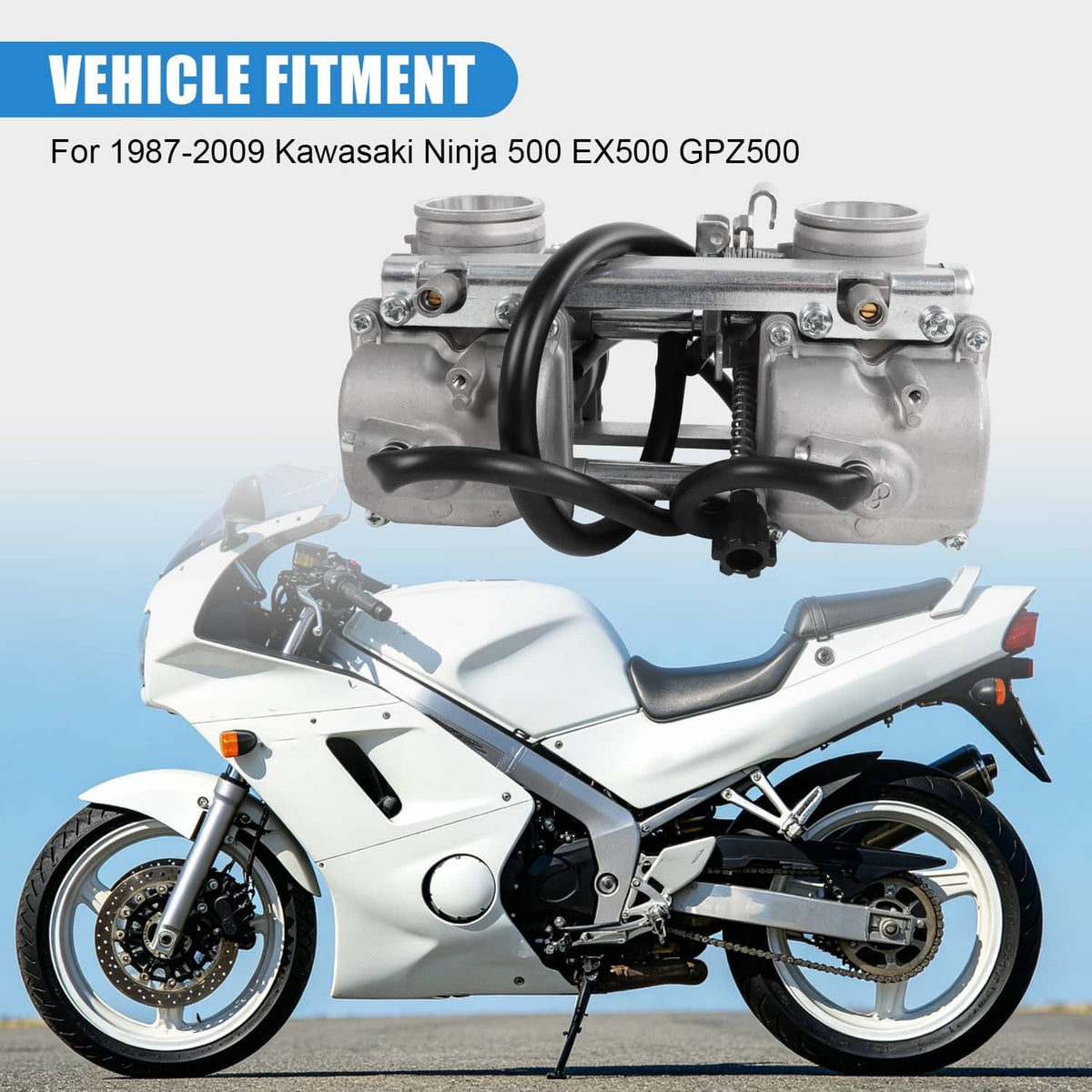 Carburetor assembly mounted on motorcycle intake area with black hoses and silver body