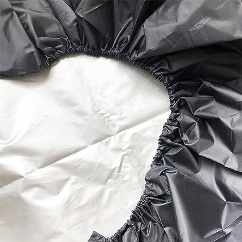 Black tire cover close-up with elastic rim edging and crinkled fabric