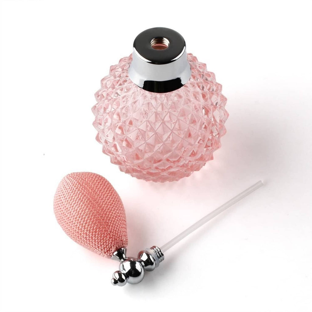Refillable perfume atomizer set with pink faceted bottle, silver cap, and spray tube