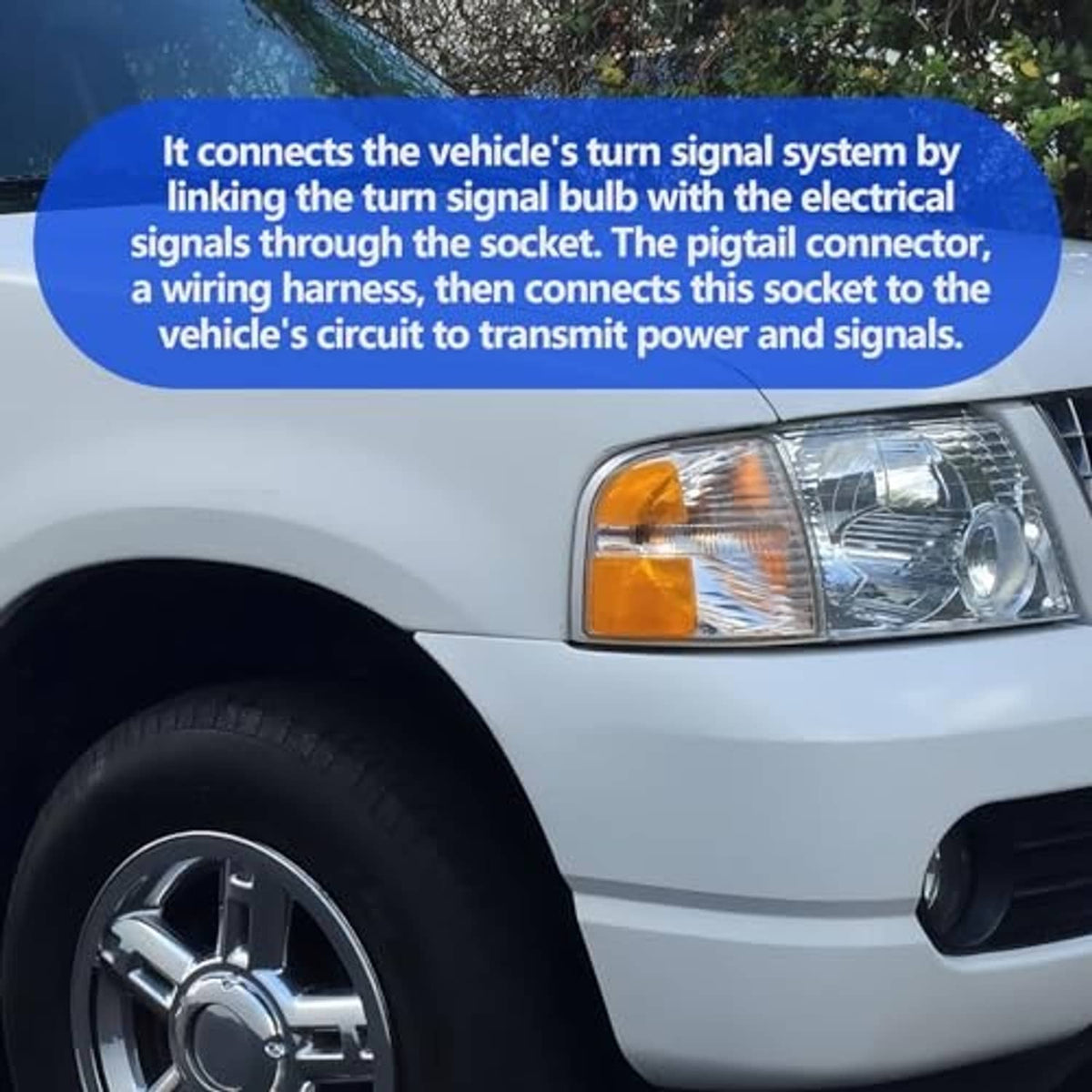 Amber turn signal lamp on a car front with clear headlight lens.