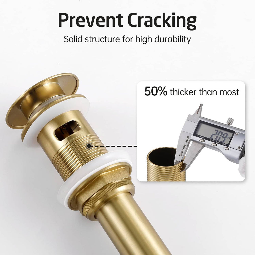 Brushed gold metal pop-up drain with thick threaded body close-up