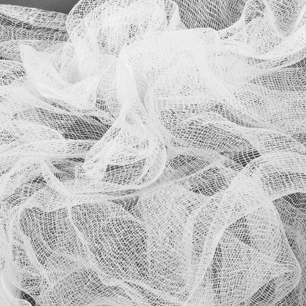 White cheesecloth with airy, gauzy loose fibers texture