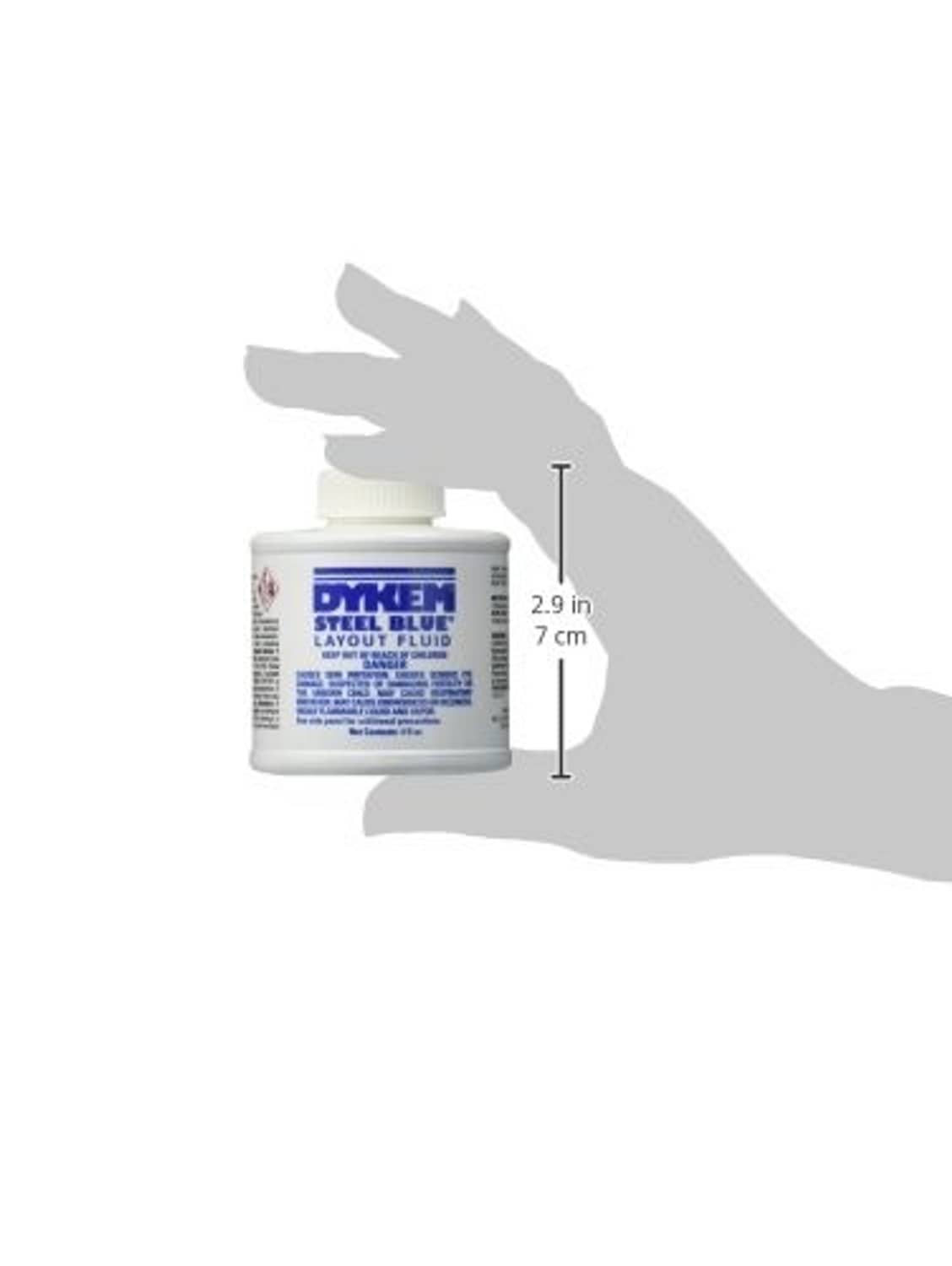 Dykem steel blue layout fluid bottle shown with hand for scale
