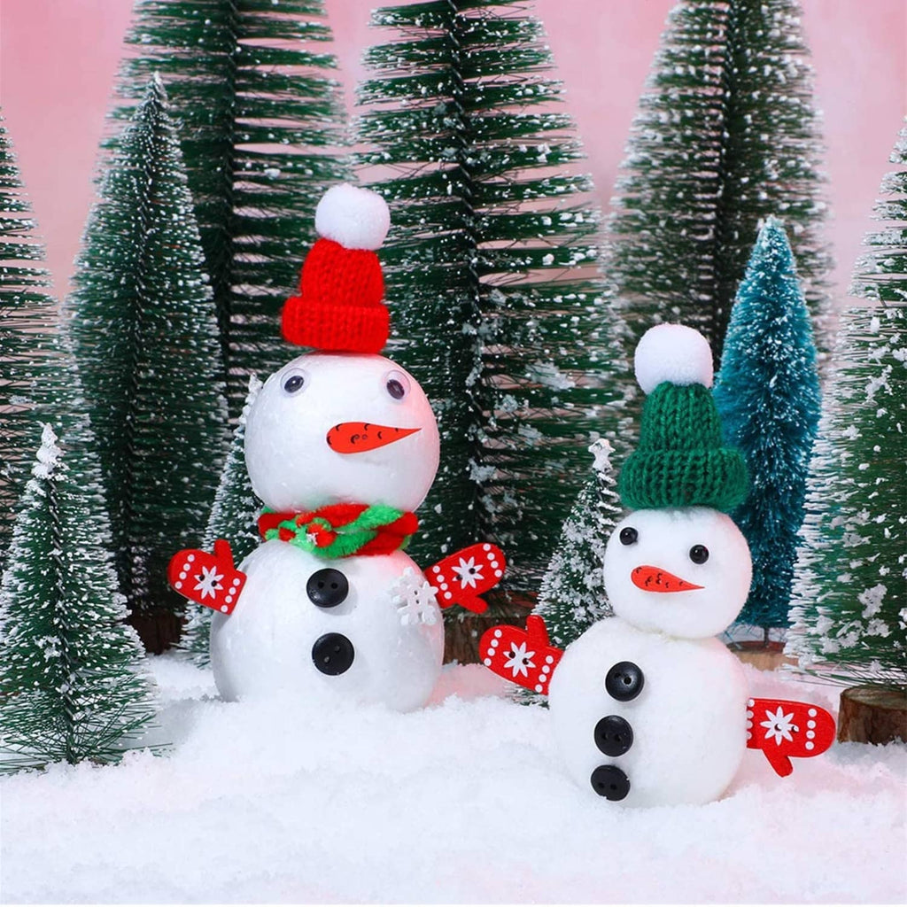 Snowman craft decorations with red carrot-shaped noses and black button eyes