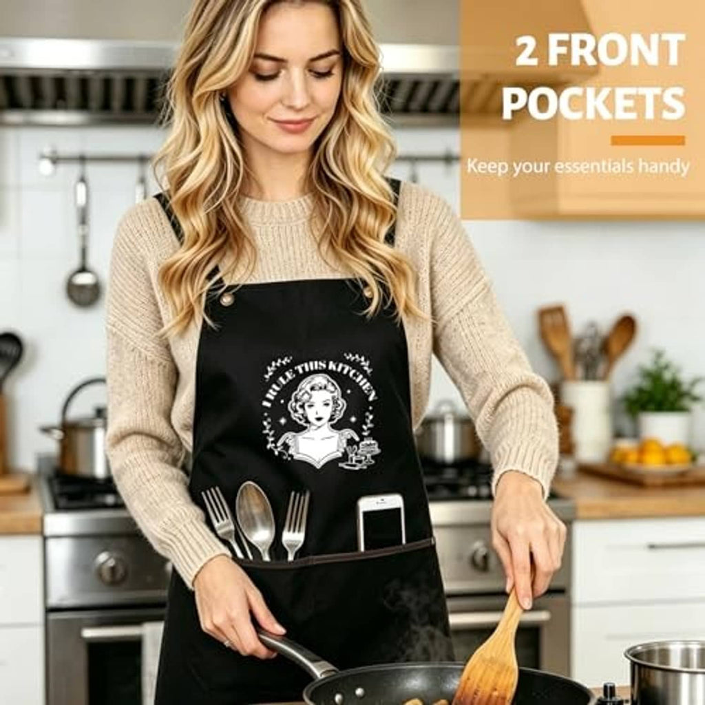 Black apron on a person with chef graphic and two front pockets