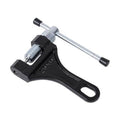 Black and silver chain breaker tool with threaded screw and lever handle