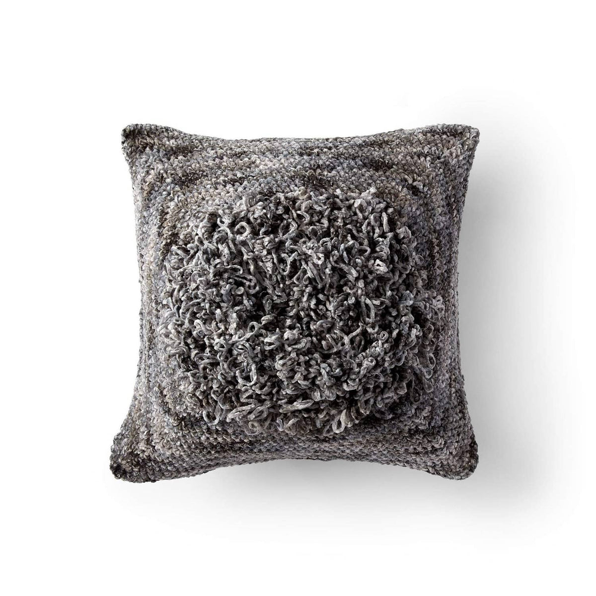 Speckled gray knit pillow with textured, fuzzy circular front