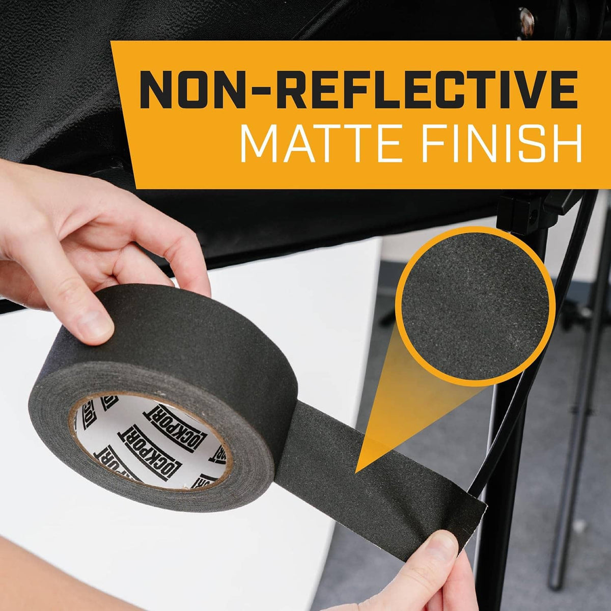 Black gaffer tape roll and strip being applied, non-reflective matte finish