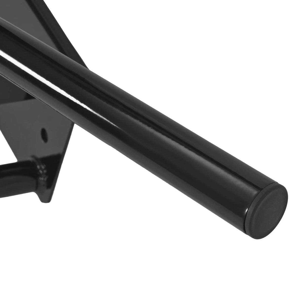 Close-up of black tubular brush guard bar end cap on bumper guard