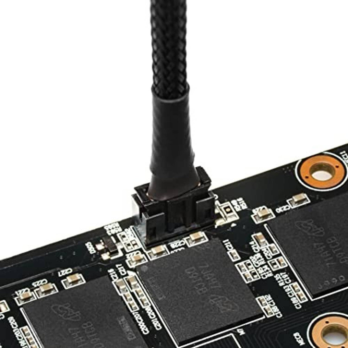 Braided fan adapter cable plugged into GPU fan header on circuit board