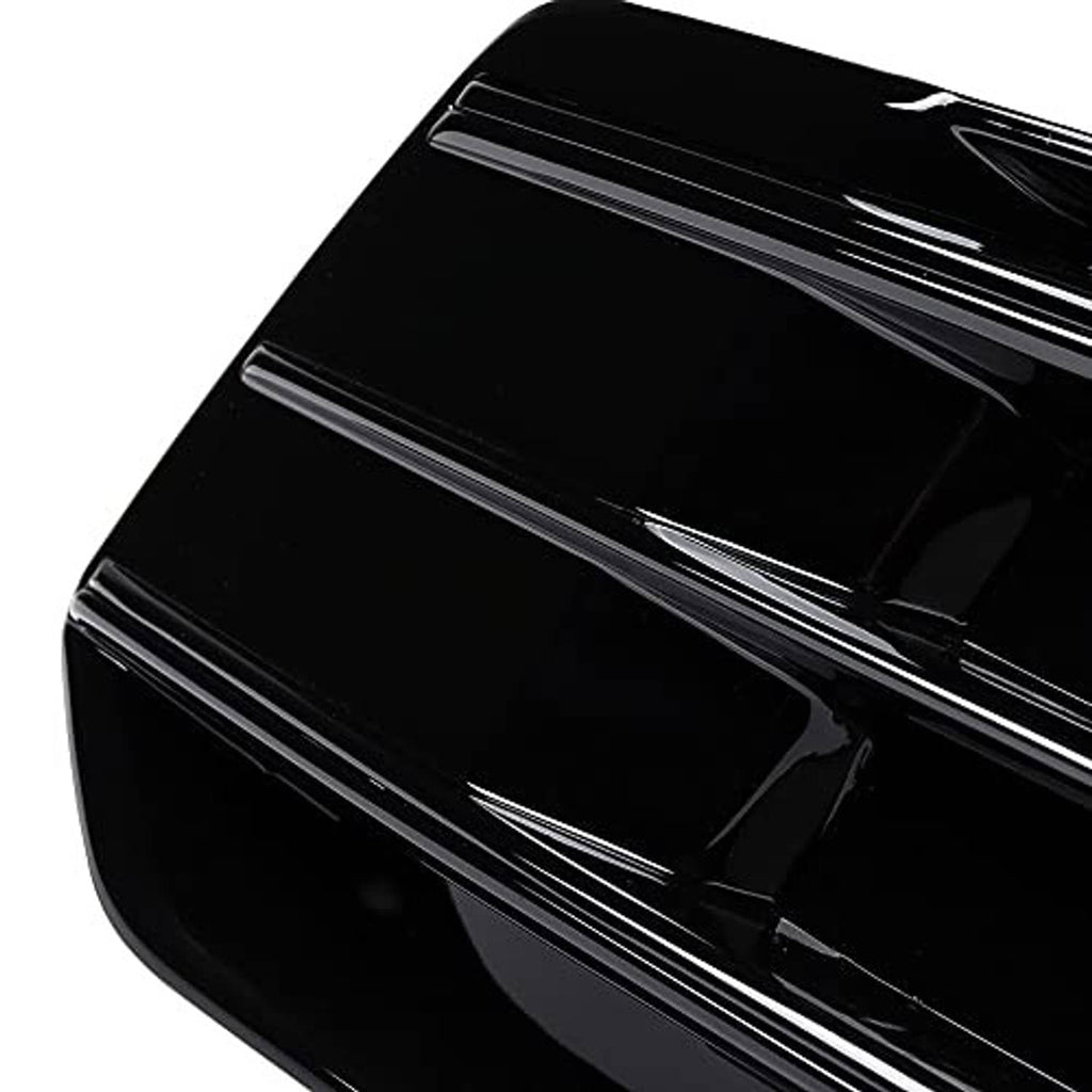Glossy black grille insert close-up with smooth surface and horizontal slat detail