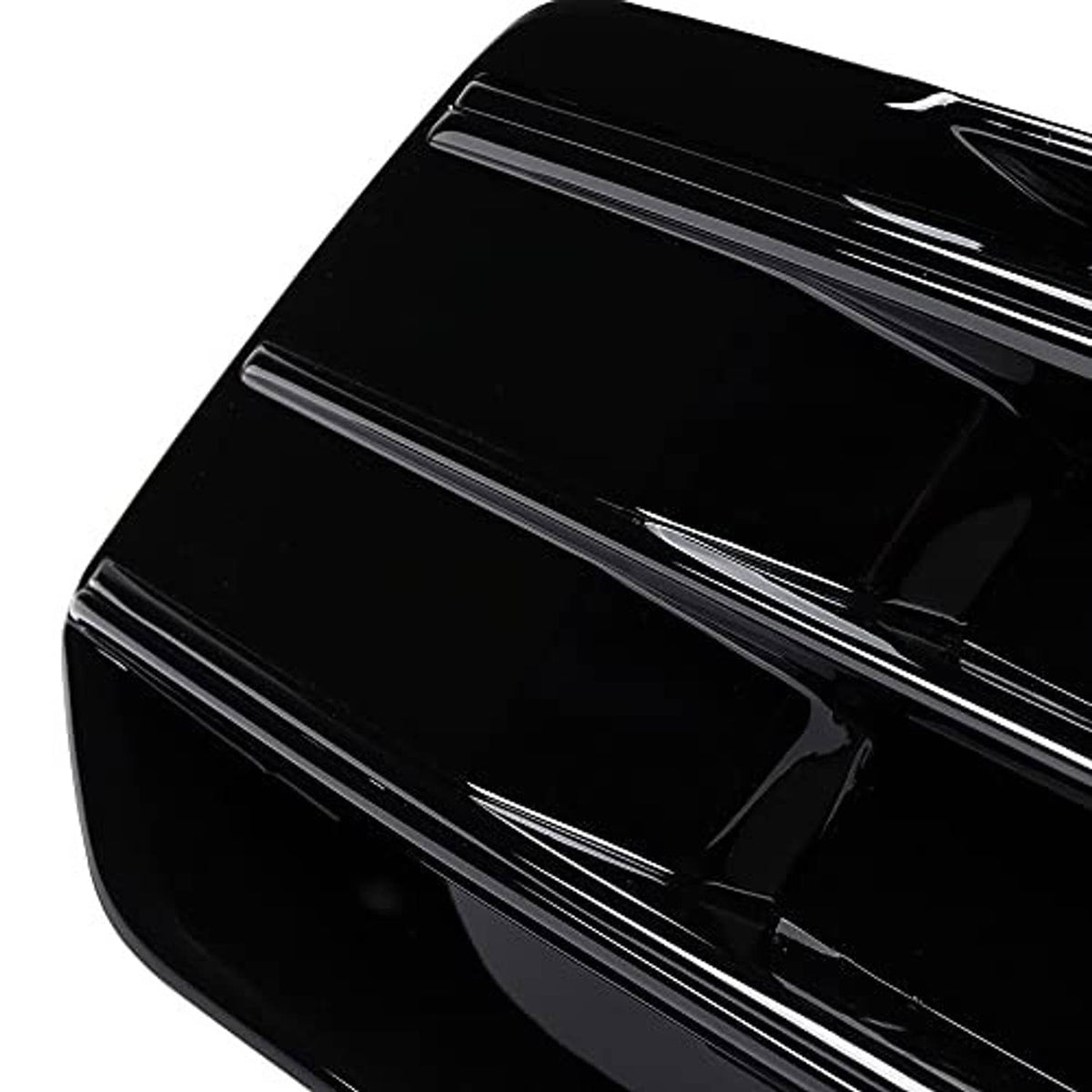 Glossy black grille insert close-up with smooth surface and horizontal slat detail