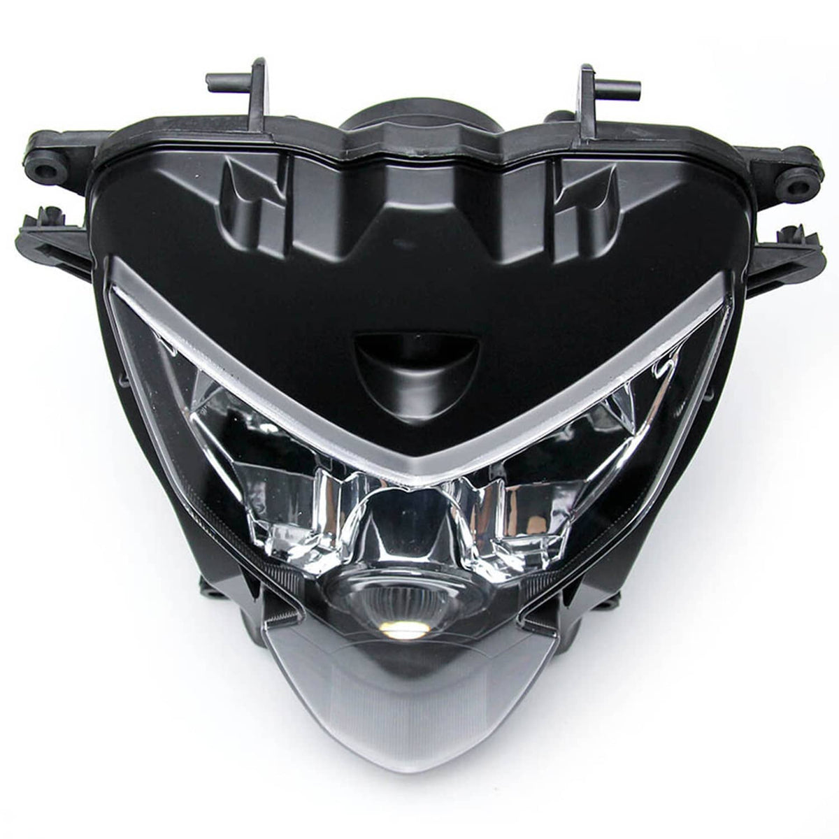Headlight assembly from front, black housing with clear reflector sections and projector