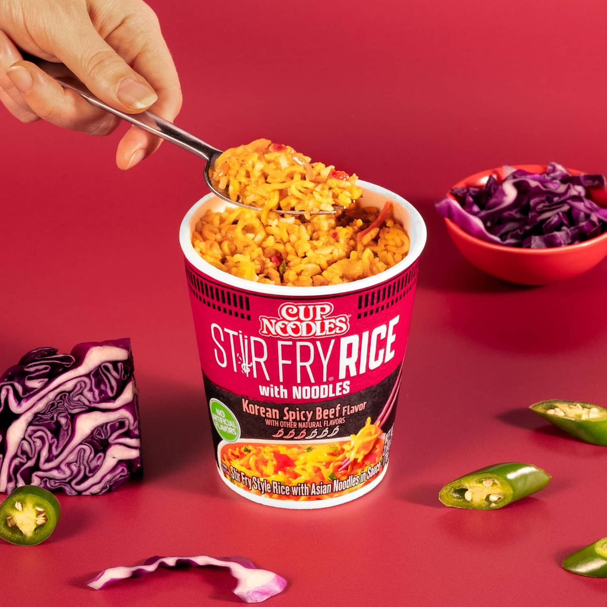Nissin Cup Noodles Stir Fry Rice cup with forked serving and noodle mixture
