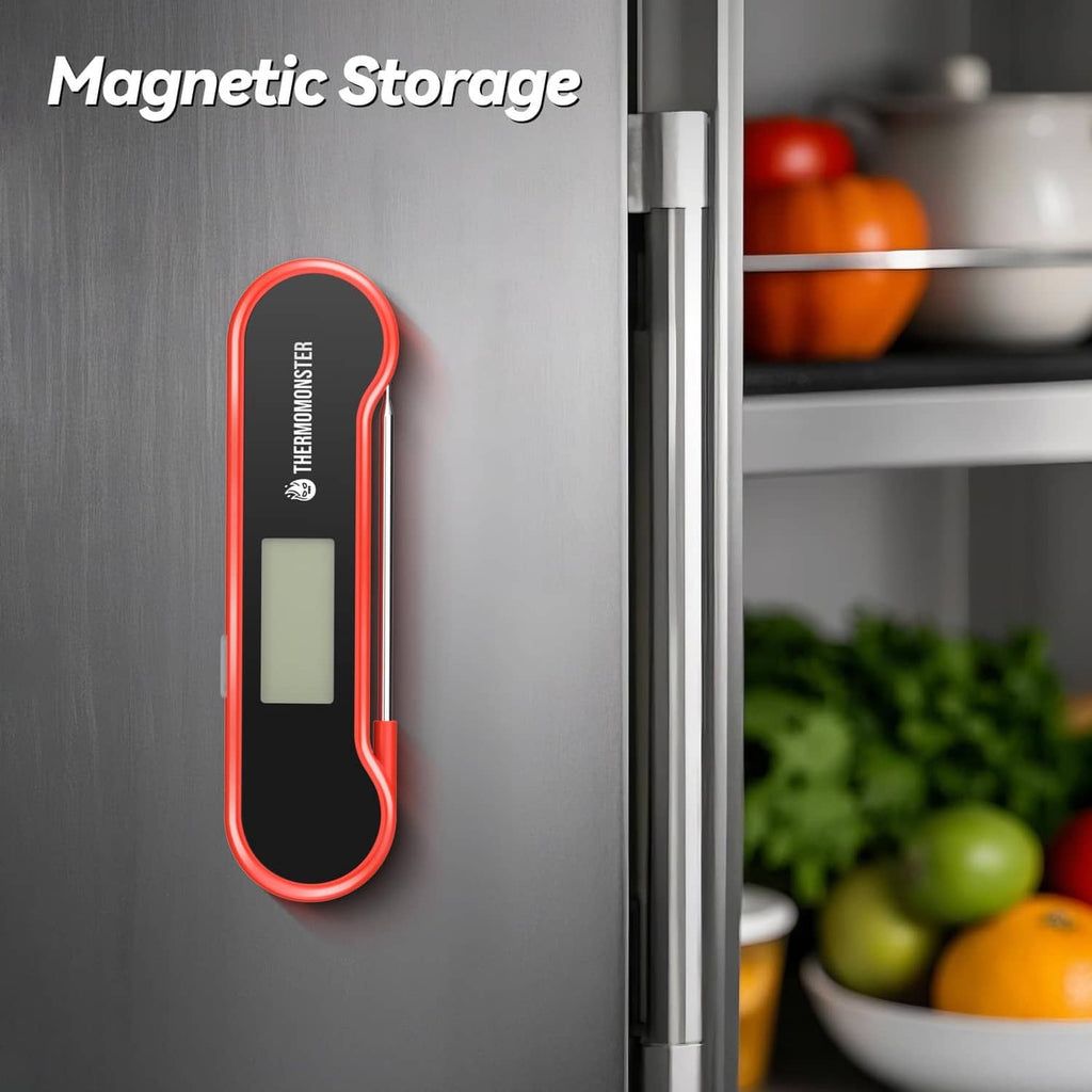 Red meat thermometer magnetically stored on a refrigerator door, LCD screen