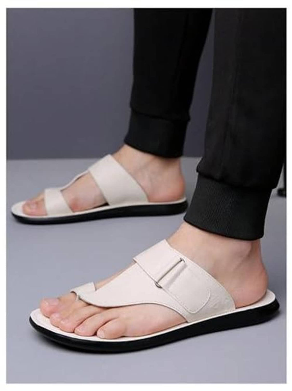 Men's white thong sandals on feet, open toe slip-on with front strap and black sole