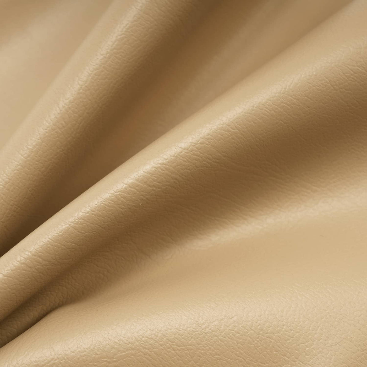 Tan golf cart seat back cover, close-up of textured vinyl surface