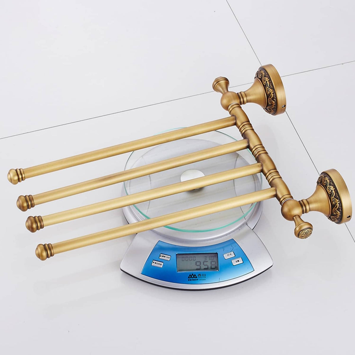 Wall-mounted 4-bar towel rack in antique bronze with decorative round wall plates.