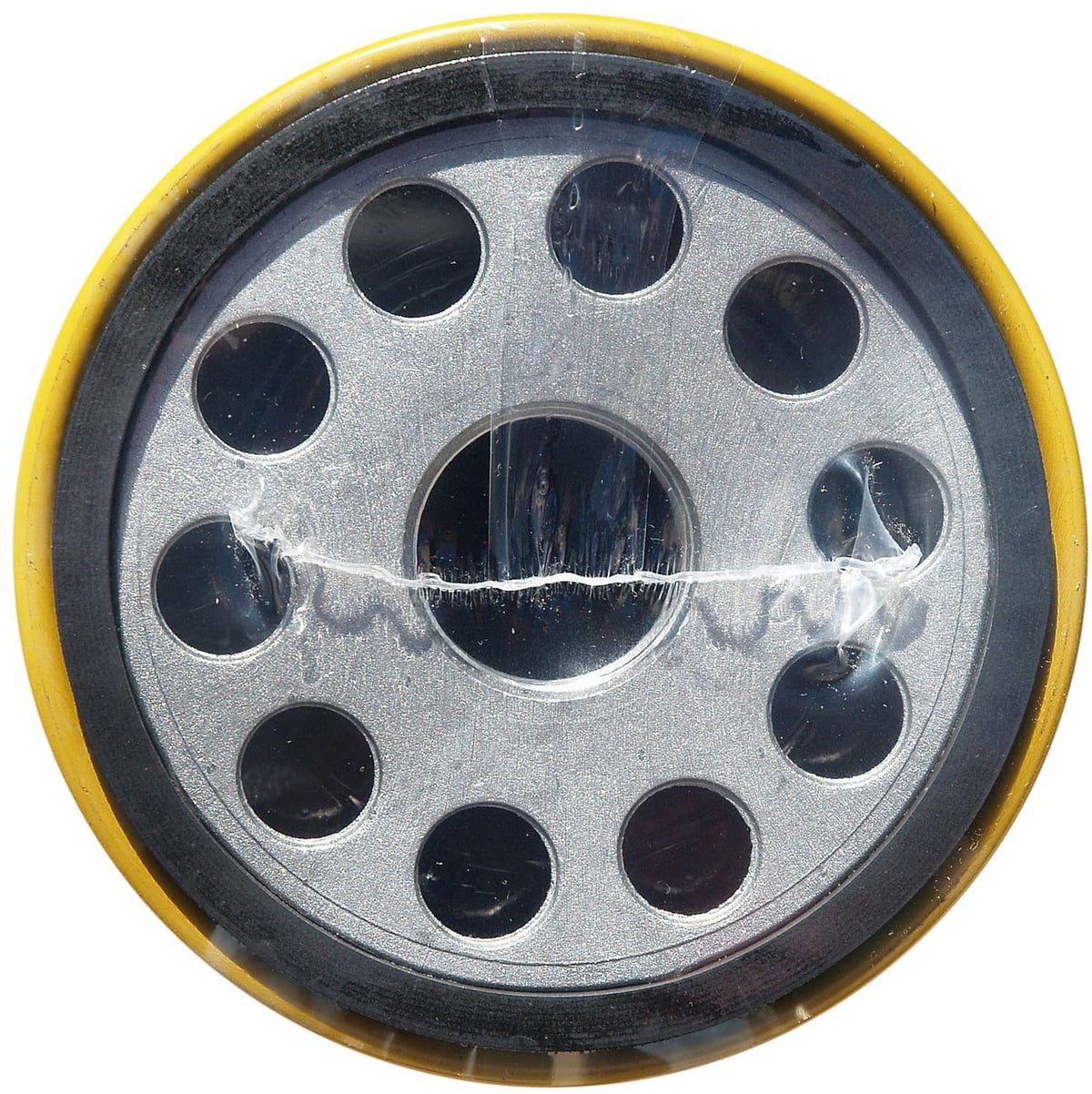 Caterpillar oil filter end cap with circular mounting holes, dark center opening