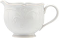 White ceramic sauce pitcher with embossed French Perle pattern and curved handle