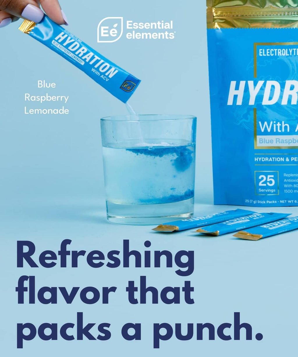 Hydration electrolyte packet being poured into a glass of blue water.