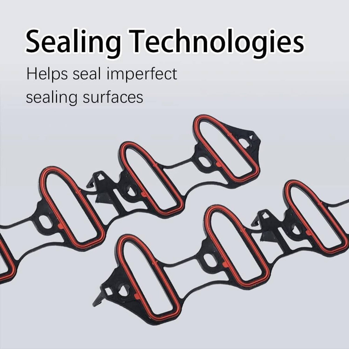 Intake manifold gaskets with red trim and black mounting tabs, close-up view