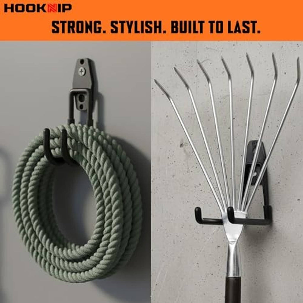 Black double wall hooks holding coiled rope and a broom handle