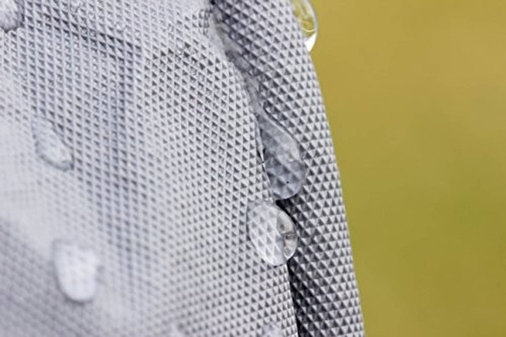 Gray generator cover fabric with strap and snap-style closure detail