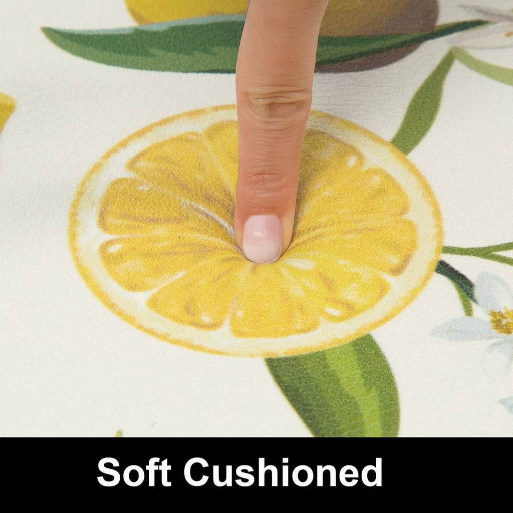 Close-up of a white lemon-print rug surface, softly indented for cushioned support