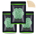 Green hard wax beads for hair removal in three resealable black bags