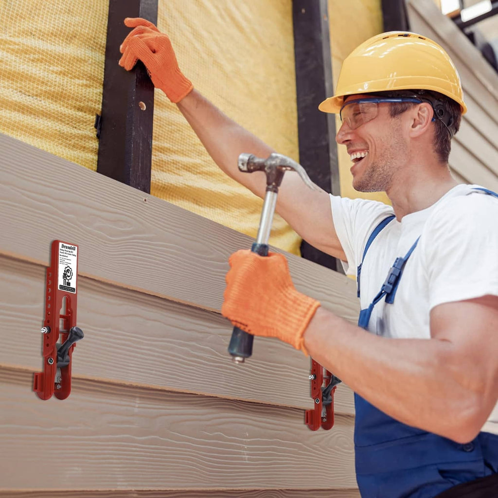 Contractor using a red siding mounting tool on wood siding with a mounted handle