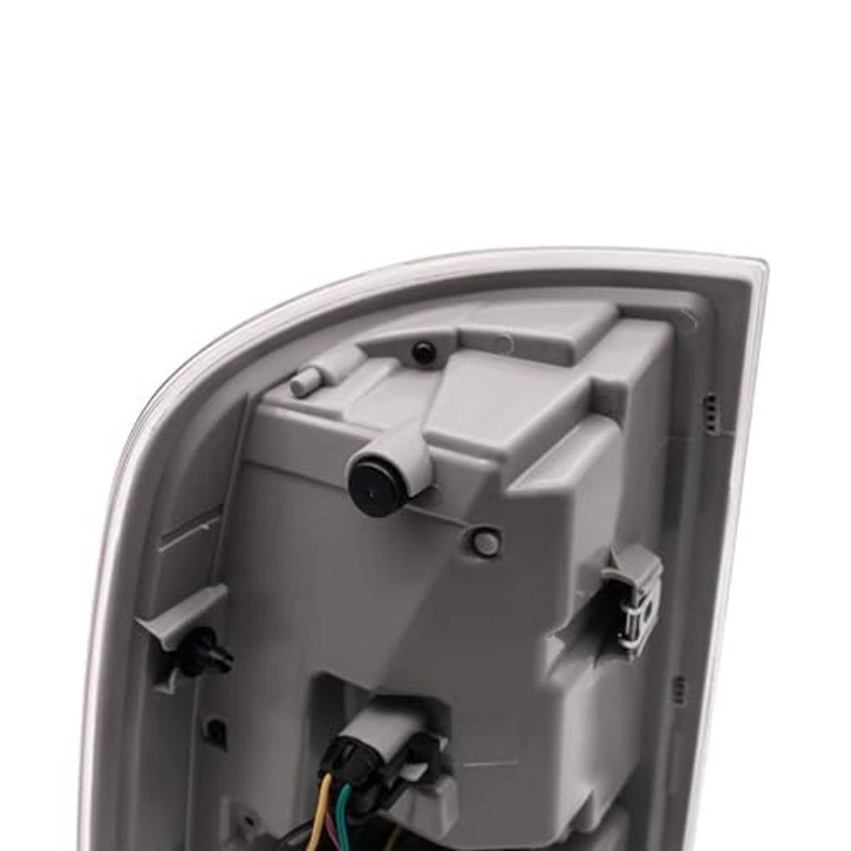 Rear view of tail light housing showing bulb sockets and wiring plug.