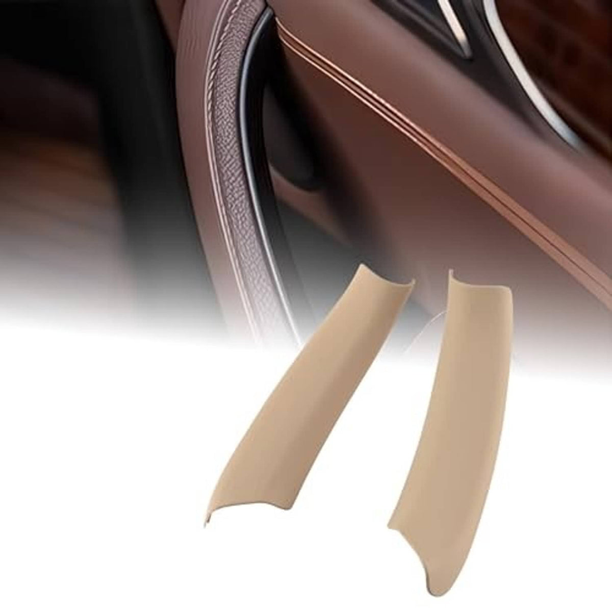 Beige interior door handle pull trim pair, curved covers shown at angle