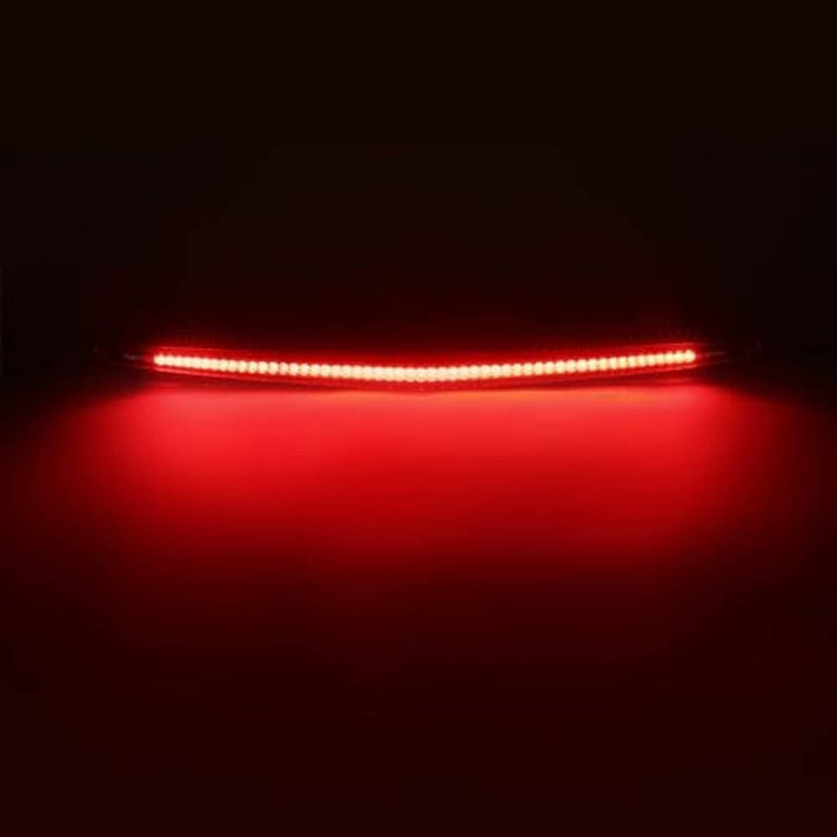 Rear LED third brake light bar lit red, long continuous light strip view.